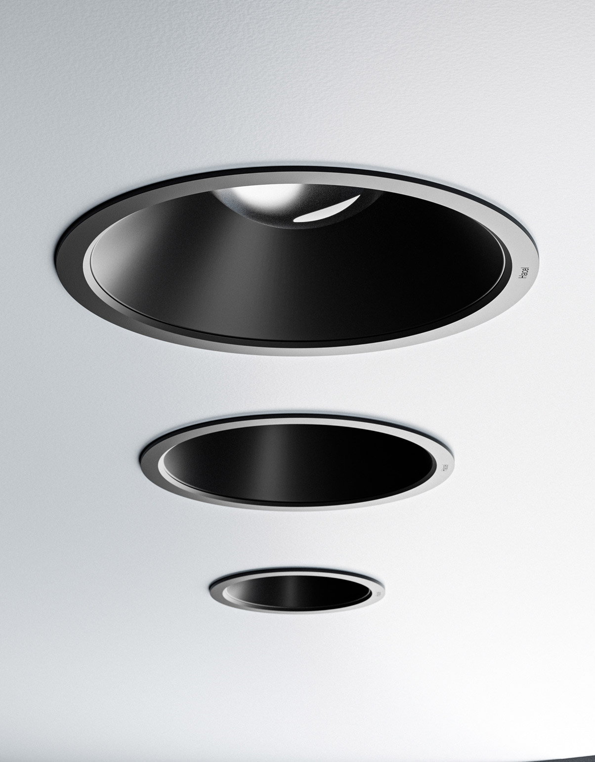 Solenz downlight with black cowl installed in a ceiling